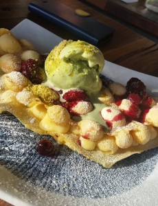 Hong Kong egg waffle with matcha ice cream and berry compote.
